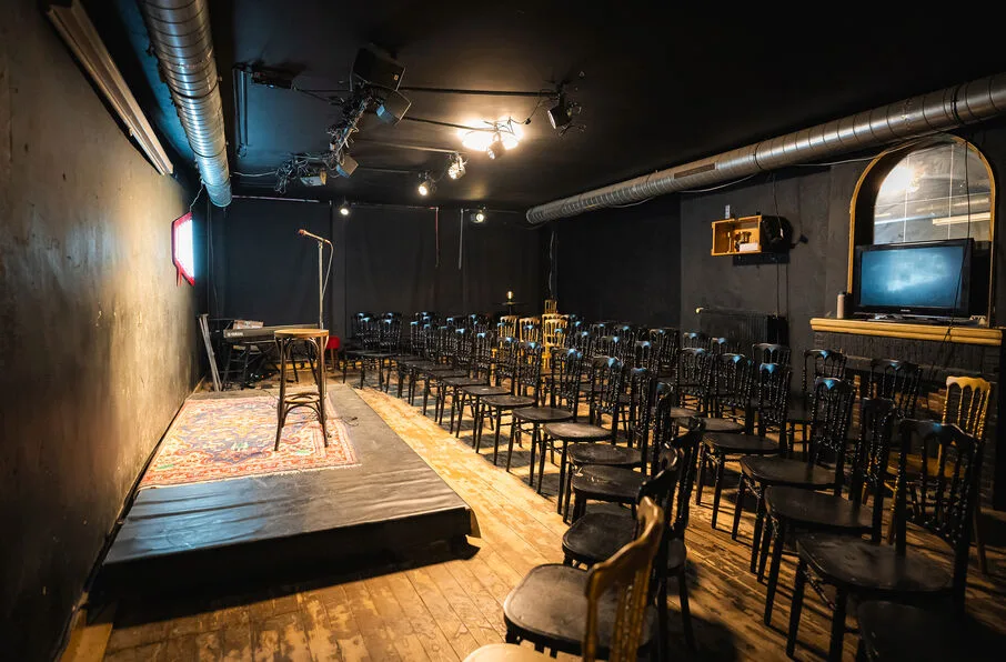 Amai Comedy Club — rows of chairs facing the stage